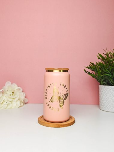 Pink glass can with an engraved gold butterfly